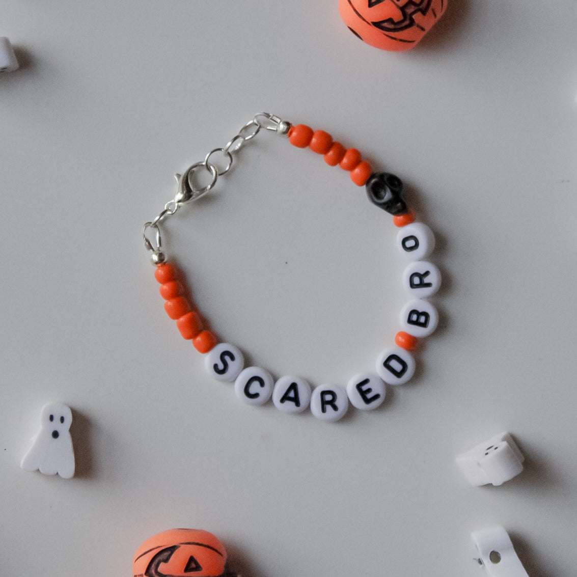 Orange Personalized Dainty with black skull