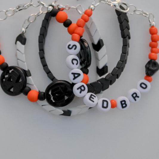 Orange Personalized Dainty with black skull