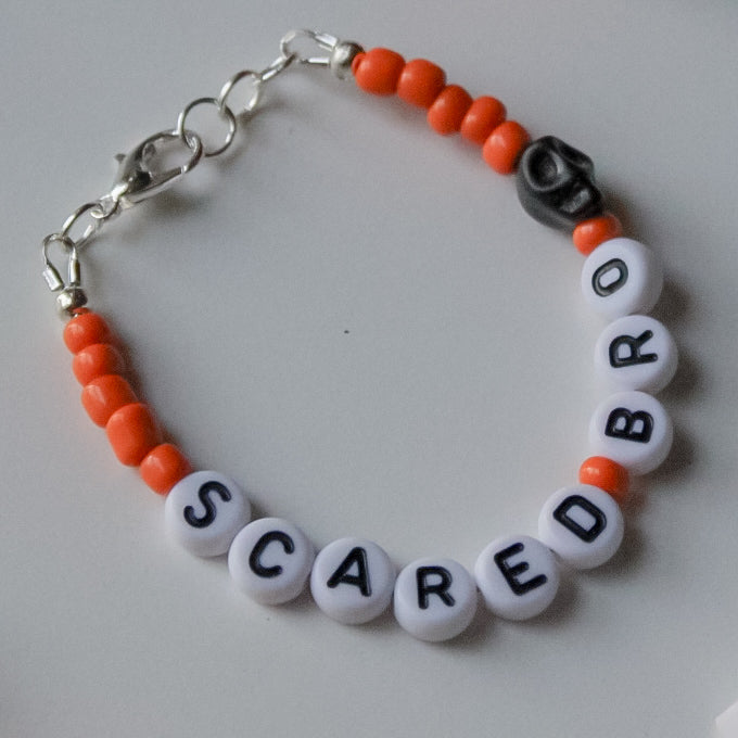 Orange Personalized Dainty with black skull